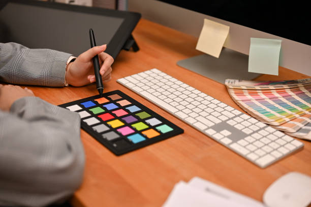 istock Female freelance graphic designer working at her home office desk. 1400215705