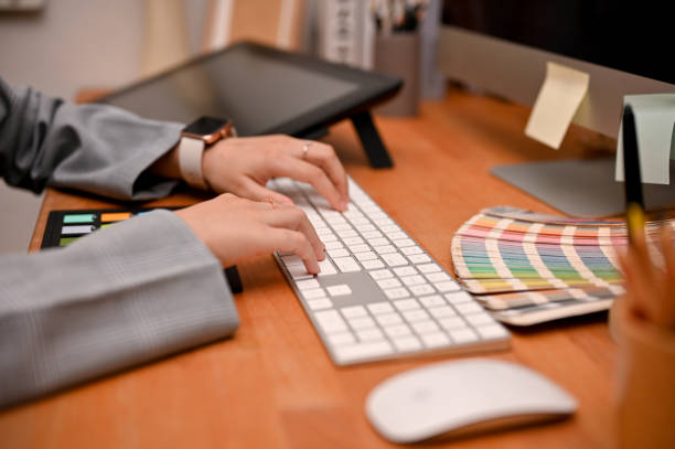 istock Female graphic designer typing on keyboard, working on her new project design. 1400215713