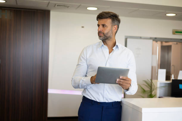 istock Portrait of a handsome businessman using tablet 1400215985