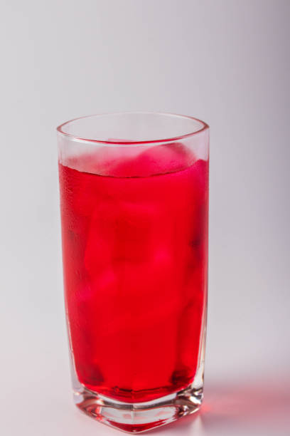 istock Red juice drink on black background 1400216465