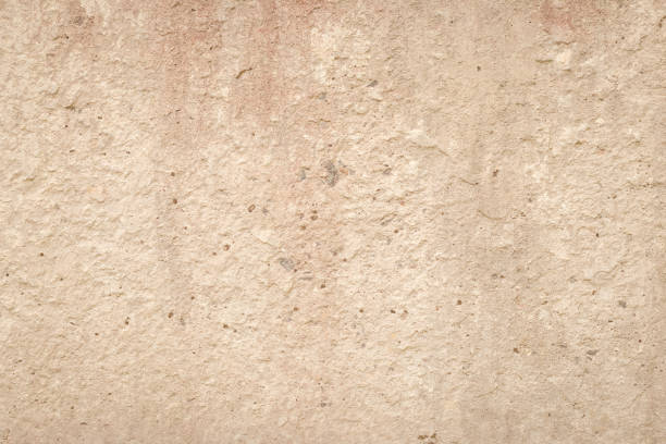 ベージュのセメントの壁、抽象的な光の背景。コンクリートグランジテクスチャ、スタッコ。石膏表面。空白スペース。デザインの背景。天然の不機嫌な壁紙。 - backdrop damaged old fashioned natural pattern ストックフォトと画像