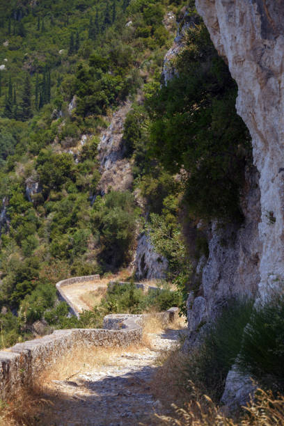 istock old cobblestone road in corfu mountains 1400221931