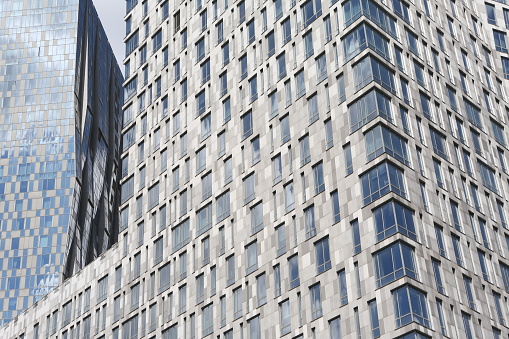 New building facade in Moscow city, Russia. Contemporary house - Mosfilm Tower. Housing complex, russian skyscraper on Mosfilmovskaya street. Modern architectural landmark. Exterior and windows.\nPhotographed on Canon EOS 5D Mark III.