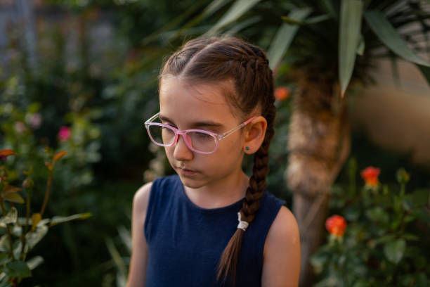 girl with roller skates,sitting and looking at the camera