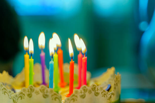 Young woman celebrating birthday on teleconference