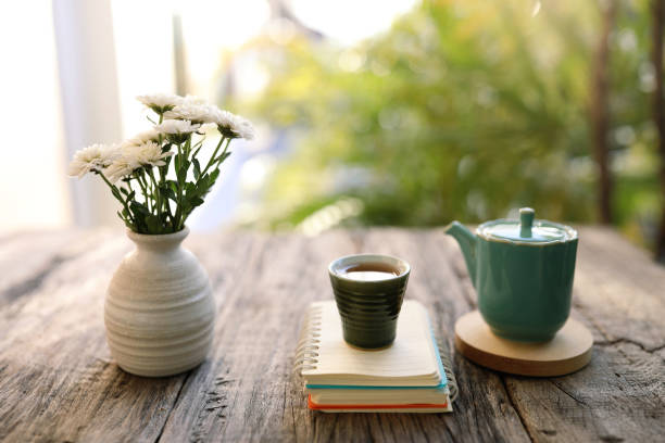 istock Old vintage ceramic cup and tea pot with white chrysanthemum vase 1400223348