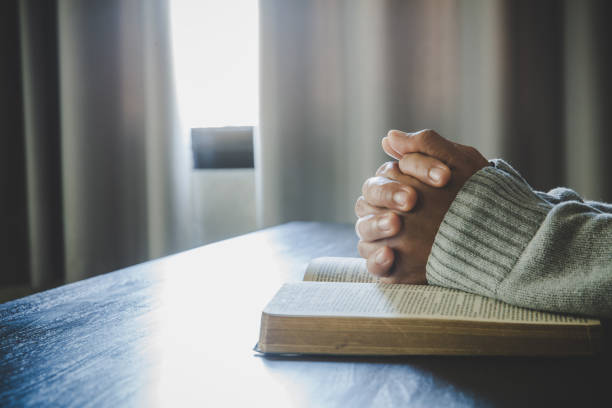 istock Asian woman praying 1400223455
