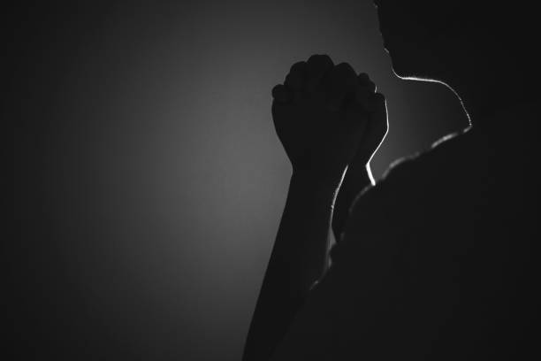 Black and white prayer hands Religion, belief, worship concept copy space: Black and white prayer hands with palms up to pray God church black and white people praying stock pictures, royalty-free photos & images