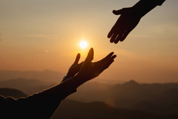 Giving a helping hand Giving a helping hand on the background of the dawn christian social union photos stock pictures, royalty-free photos & images