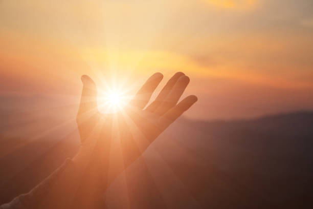 istock woman worship on sunset 1400223762