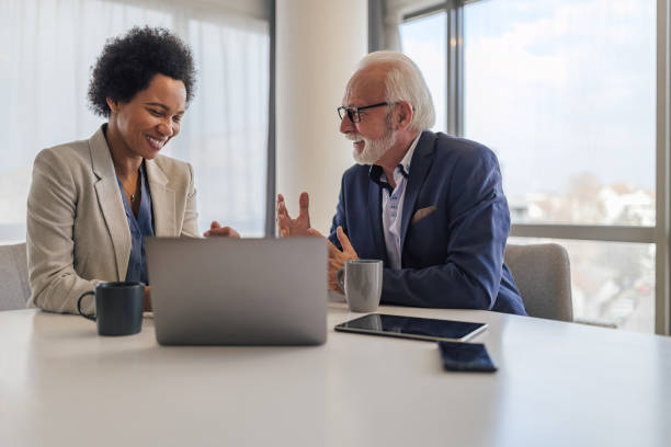 istock Happy professionals discussing successful business plan in meeting at office 1400224477