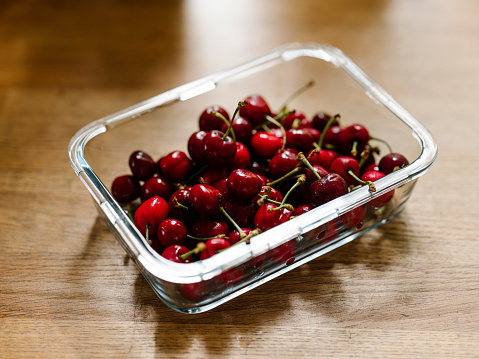 Cherries in a bowl ready to eat\nCandid photo of real food