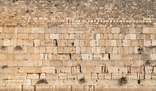 The Western wall, Kotel Wailing wall, holy place. No people. Temple mount, old city of Jerusalem, Israel. Ancient brick wall texture panoramic view.