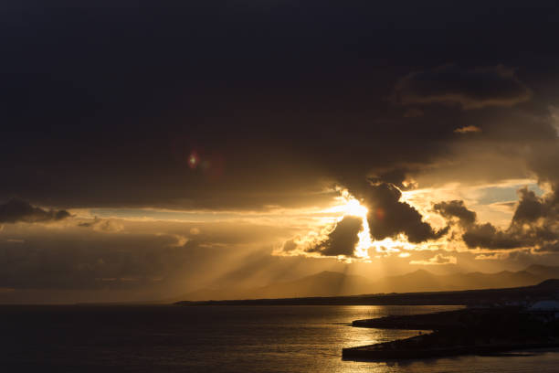 istock sunset on yellow sand beach with clouds. Lanzarote, Canary Islands, Spain 1400229697