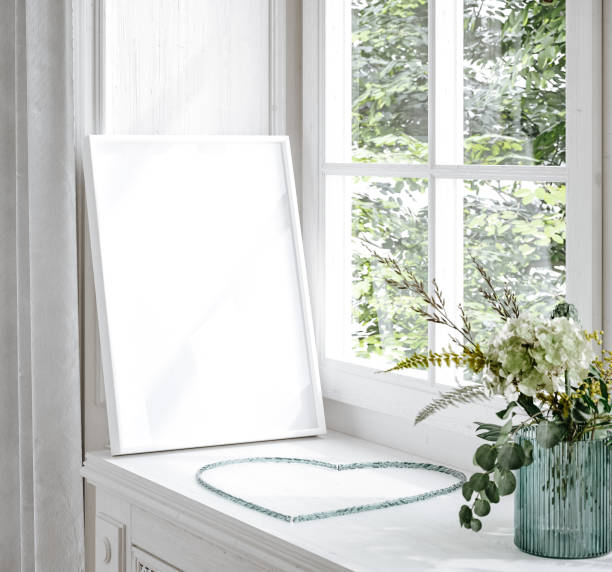 istock Mockup frame and flowers standing close up near window 1400234547
