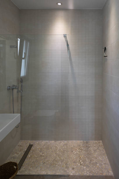 istock Stylish modern grey shower with original stones floor to be more relaxing 1400236864
