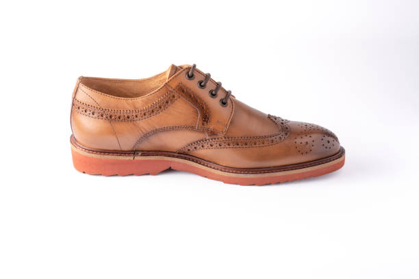 istock Elegant men's shoe in brown leather, isolated on a white background 1400237407