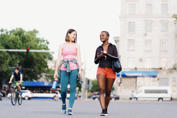 istock Two multiethnic girls walking for a exercise session, outdoor communicating. 1400238265