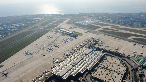 Airplane parking in a hanger inside airport . Elements of this image furnished by NASA . https://nasasearch.nasa.gov/search/images?affiliate=nasa