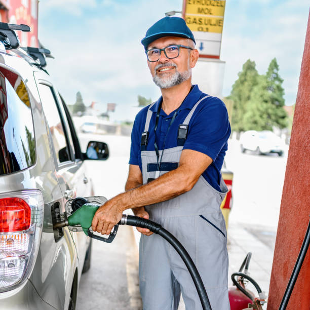 istock Mature man working on gas station. 1400239924