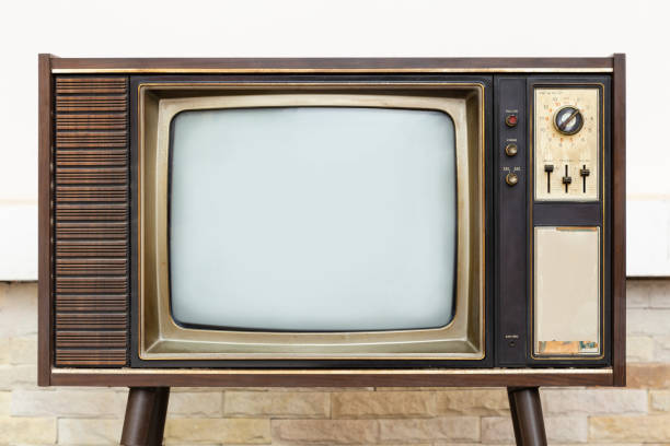 istock Retro, old television stands with brick wall background 1400241164