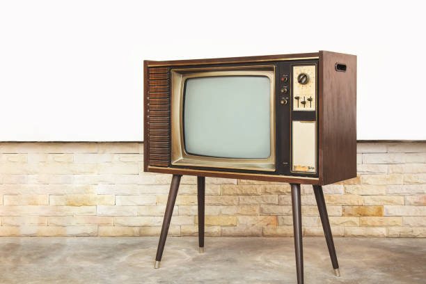 istock Old TV standing on the cement floor with brick wall background. 1400241169