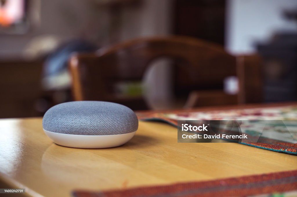 Smart Speaker at Home voice controlled smart speaker in a interior home environment. Smart home ai concept Home Automation Stock Photo