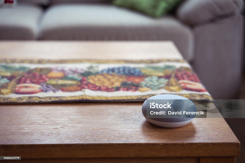 Smart Speaker at Home voice controlled smart speaker in a interior home environment. Smart home ai concept Artificial Intelligence Stock Photo