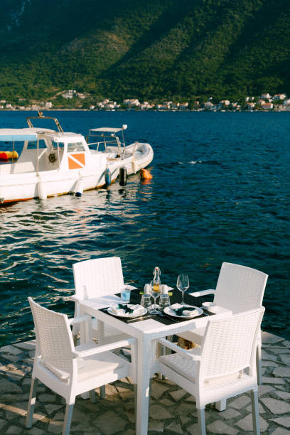 istock Table And Chairs Arranged By Sea 1400245753