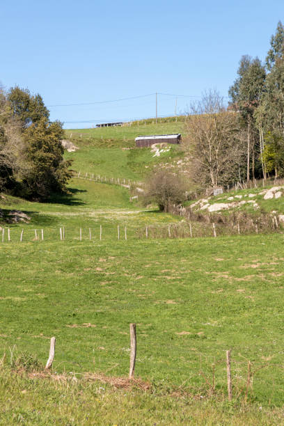 istock basque country hill with green meadows and a cabin 1400246044