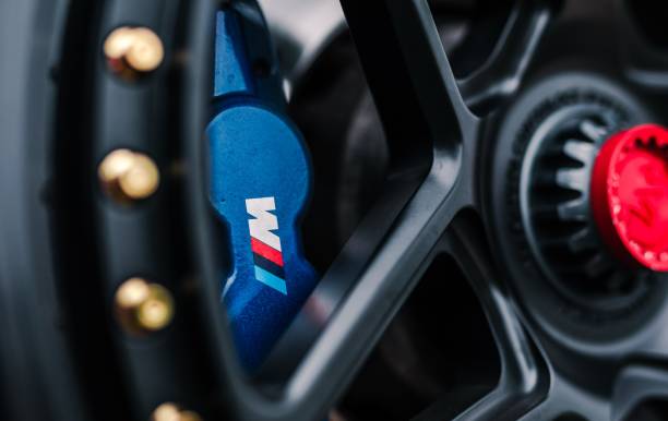 Seattle, WA, USA\n5/30/2022\nBMW M Power Brake calipers in blue behind a black wheel