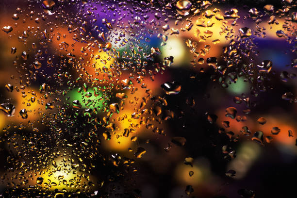istock Condensation on the clear glass window. Water drops. Rain. Abstract background texture 1400251601