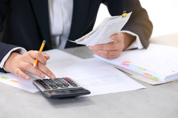 istock A woman filing a tax return 1400253626