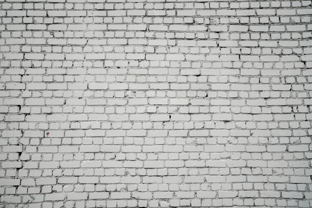 Large and long white aged brick wall front view outdoor
