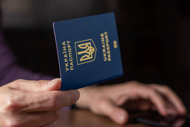 istock New ukrainian blue biometric passport with identification chip in hands 1400255890