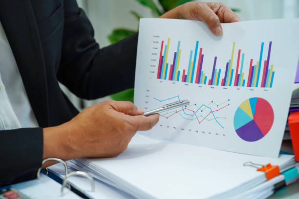 istock Businessman working and analysis with statistic graph in office. 1400256466