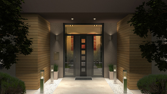3D rendering of a modern home enttrance with front door and yard illuminated by night
