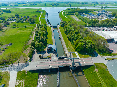 Spooldersluis lock in the Zwolle IJssel canal seen from above towards the river IJssel in the background in Overijssel, Netherlands.