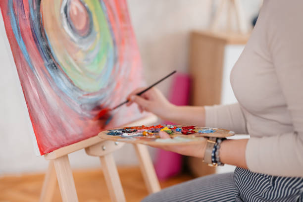 istock Young Female Artist Panting At Home 1400259691