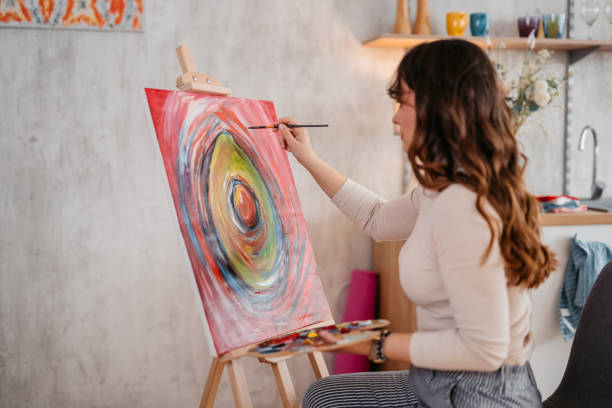 istock Young Female Artist Panting At Home 1400259729