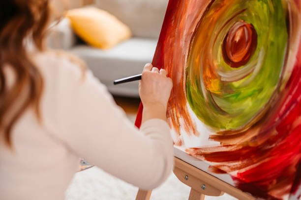 istock Young Female Artist Panting At Home 1400259767