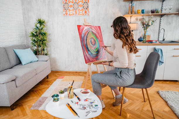 istock Young Female Artist Panting At Home 1400259785