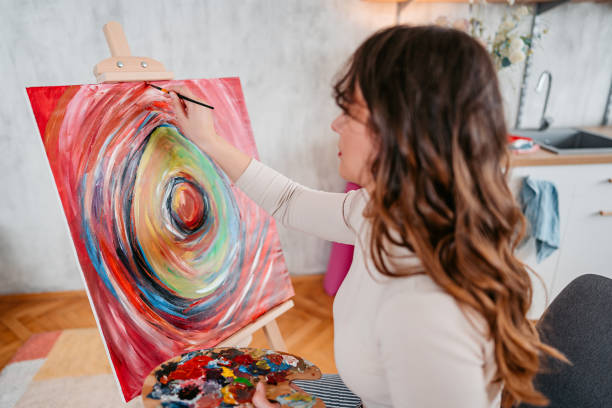 istock Young Female Artist Panting At Home 1400259801