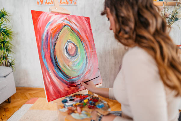 istock Young Female Artist Panting At Home 1400259816