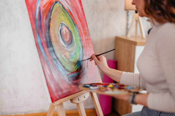 istock Young Female Artist Panting At Home 1400259820