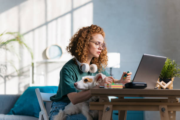 istock Adult female student studying online using a laptop 1400259933