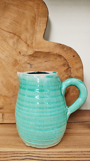 design ceramic jug with wooden background, scandinavian style