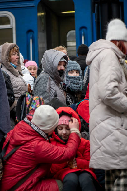 People waiting for a train at the Lviv train station in Ukraine stock photo