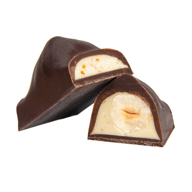 istock Chocolate sweet candy with nut glazed in half isolated on the white background 1400266985