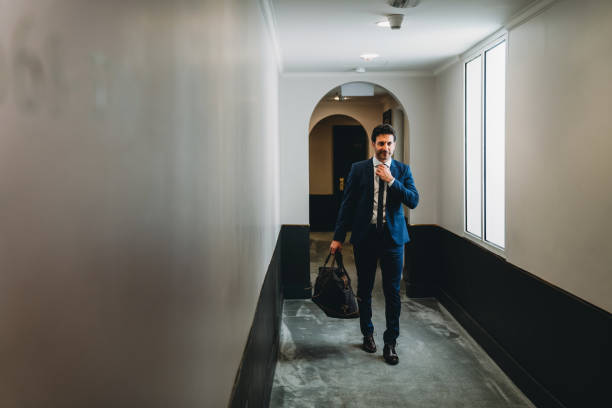istock Businessman is walking in a hotel corridor 1400267043